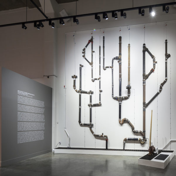 large scale pipe installation vertically on wall
