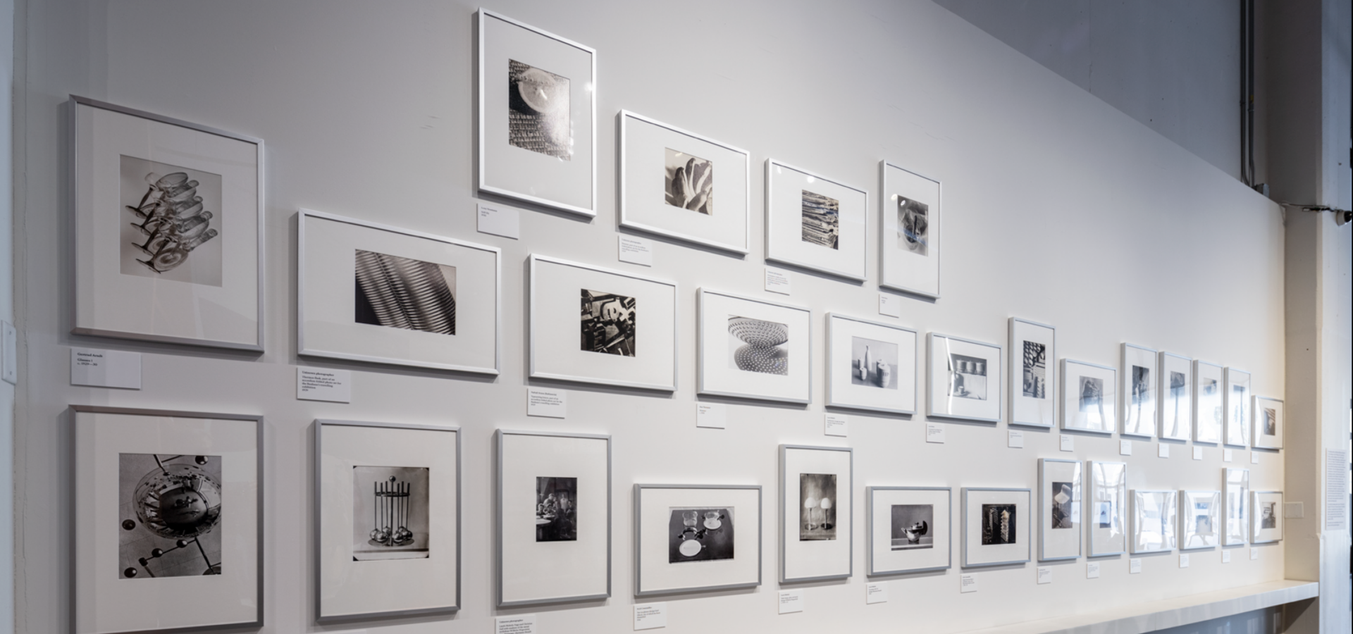Black and white photos hung on a wall