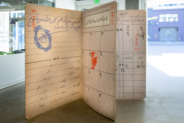 A large free-standing replica of a passport.