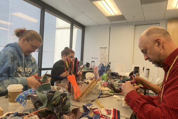 A group of people crafting during MCD's MakeArt Accessible event at the LightHouse for the Blind and Visually Impaired