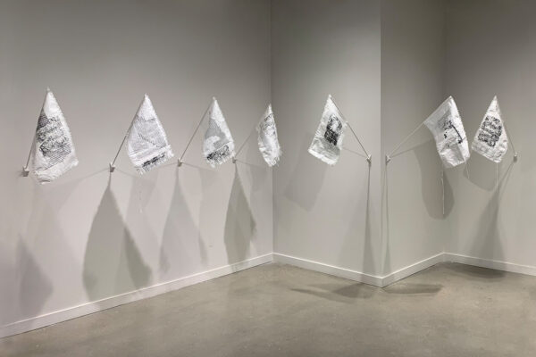 white and black flags hung on wall
