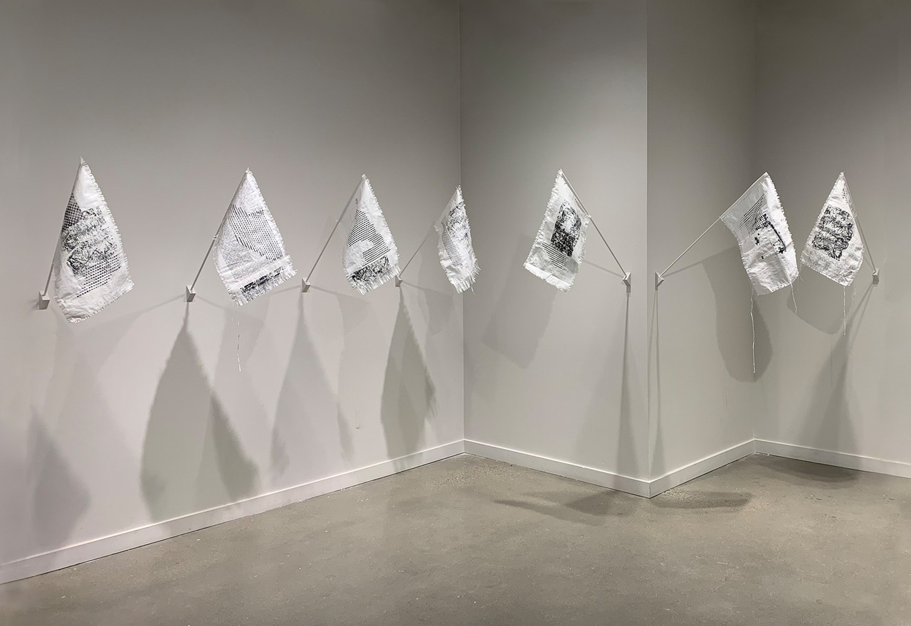 white and black flags hung on wall