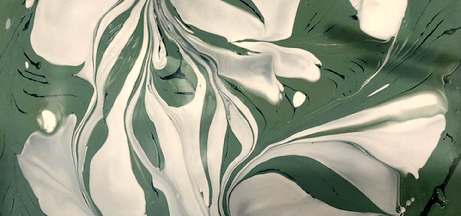 Green and white swirled paint