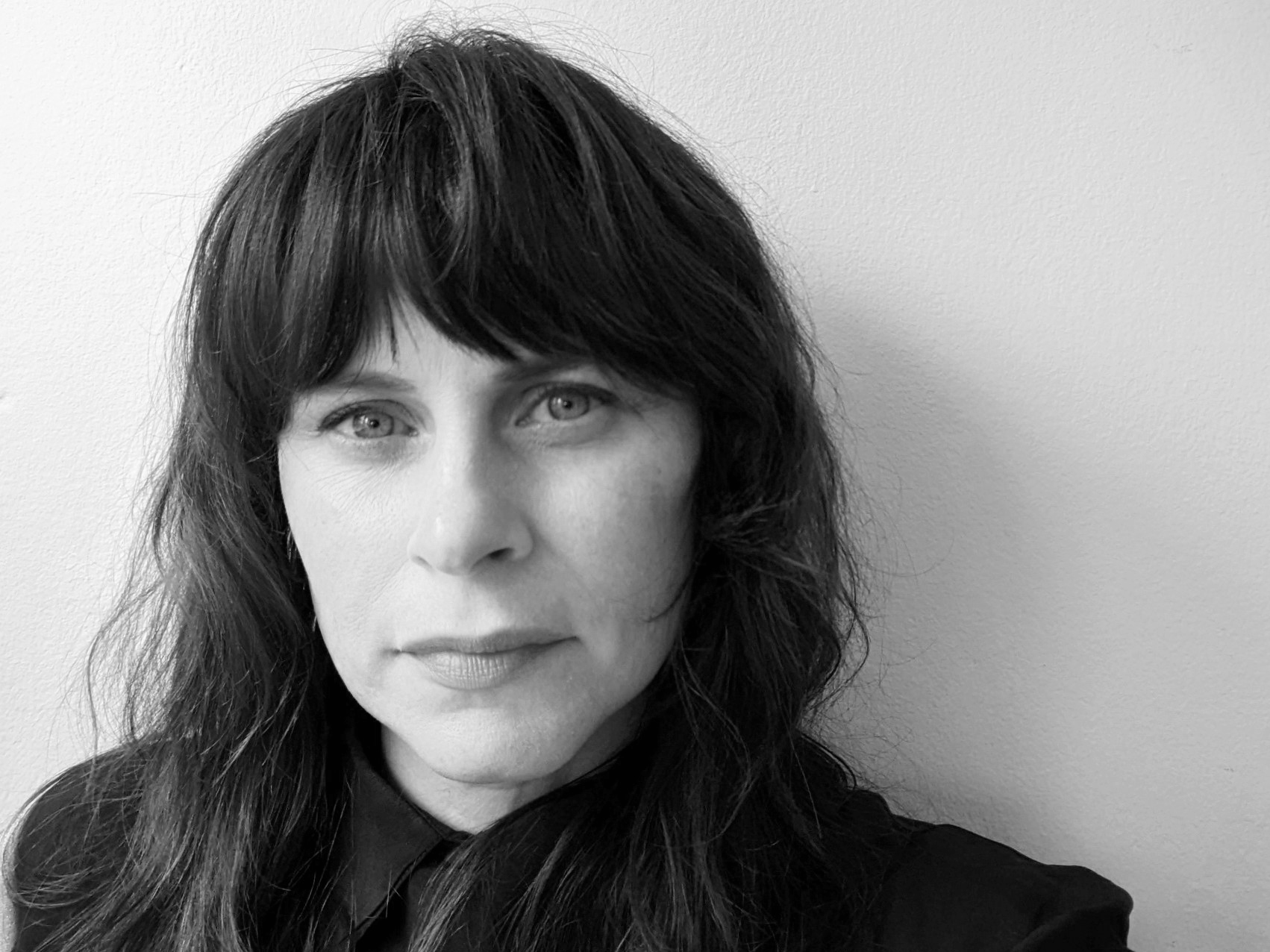 Black and white headshot of Sarah Kermensky