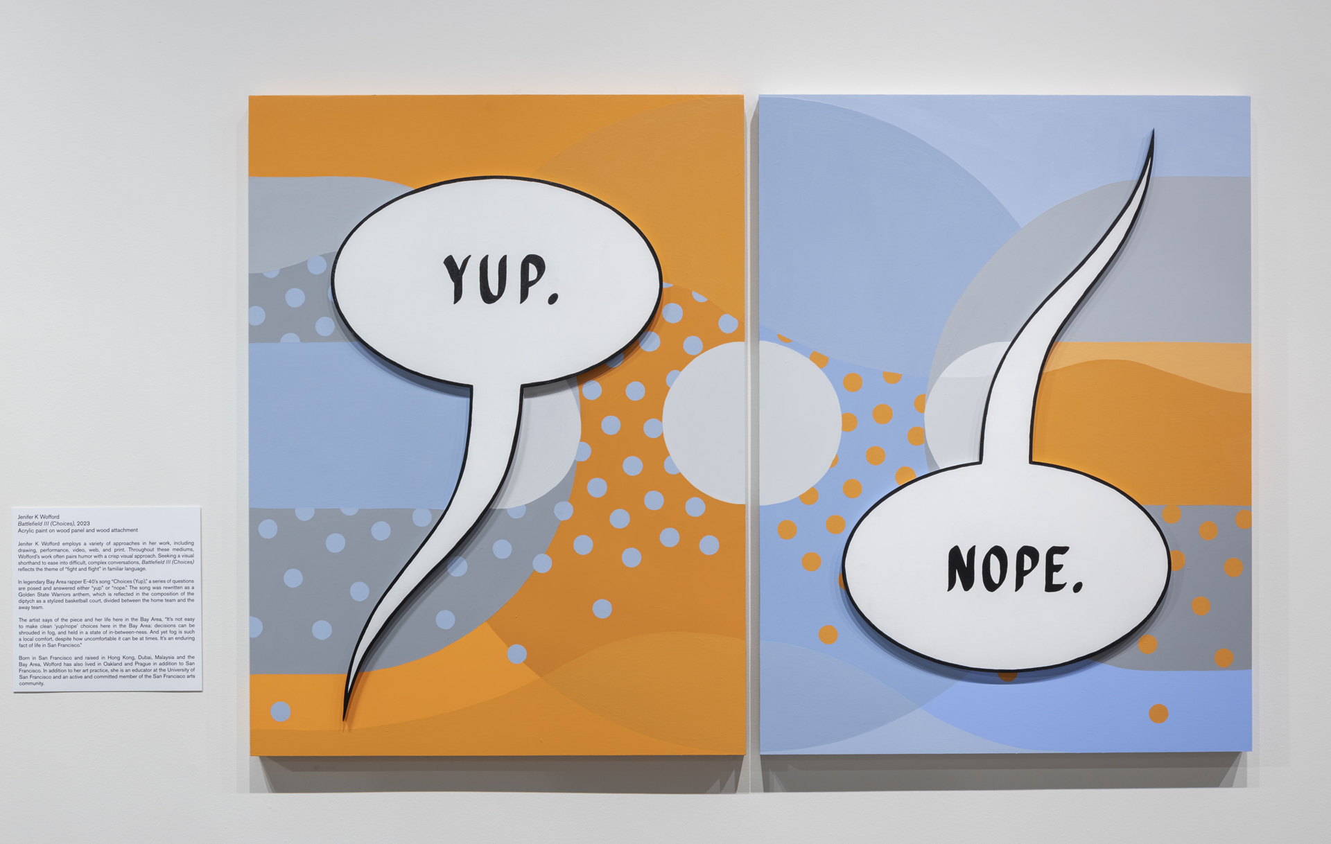 Two rectangle works of art hanging on a wall with words 'Yup' and 'Nope' in bubbles