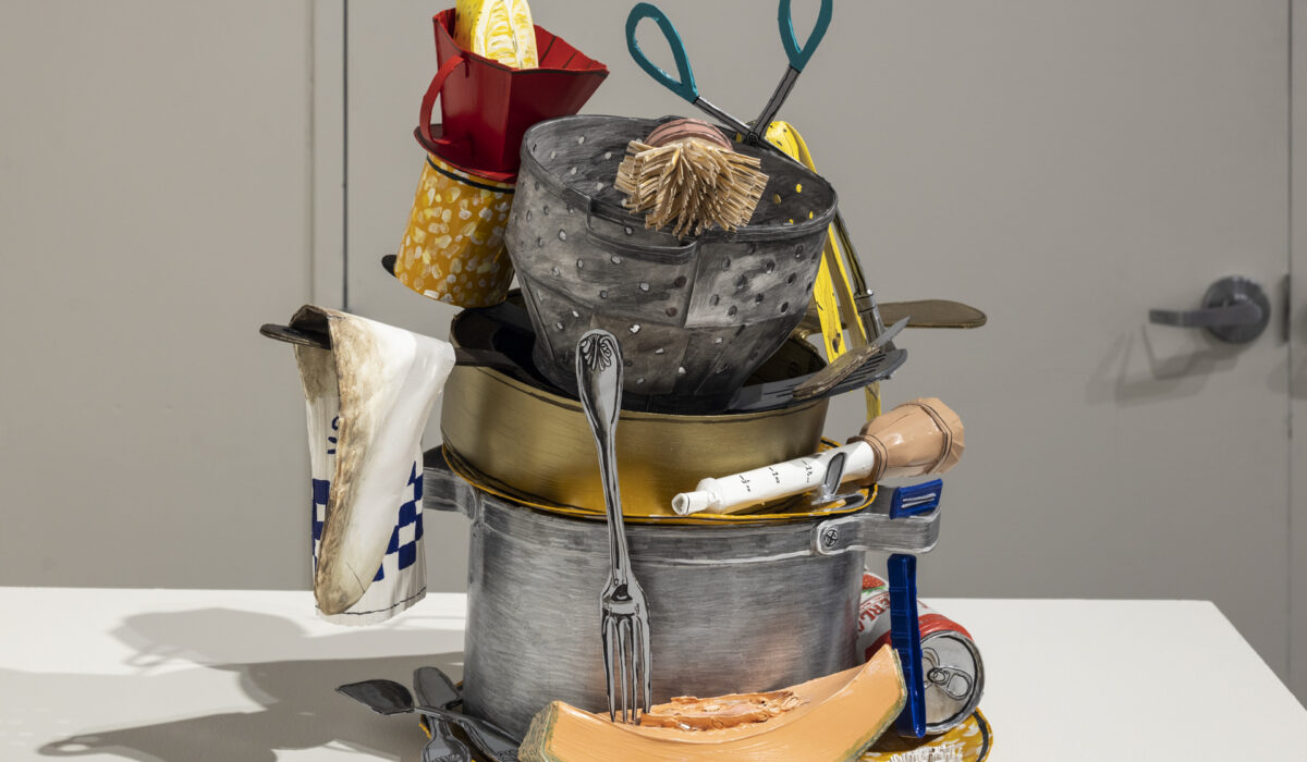 Sculpture made from paper to look realistic of dishes and food piled up