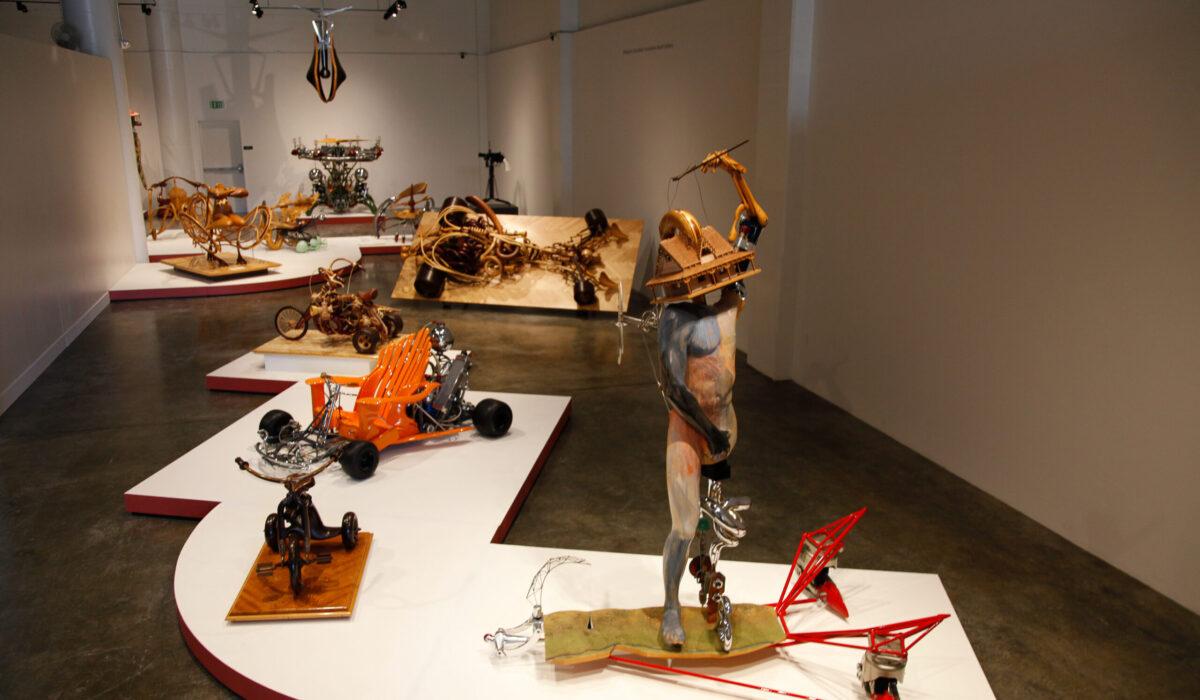 Photo of the inside of an exhibition with different types of sculptures