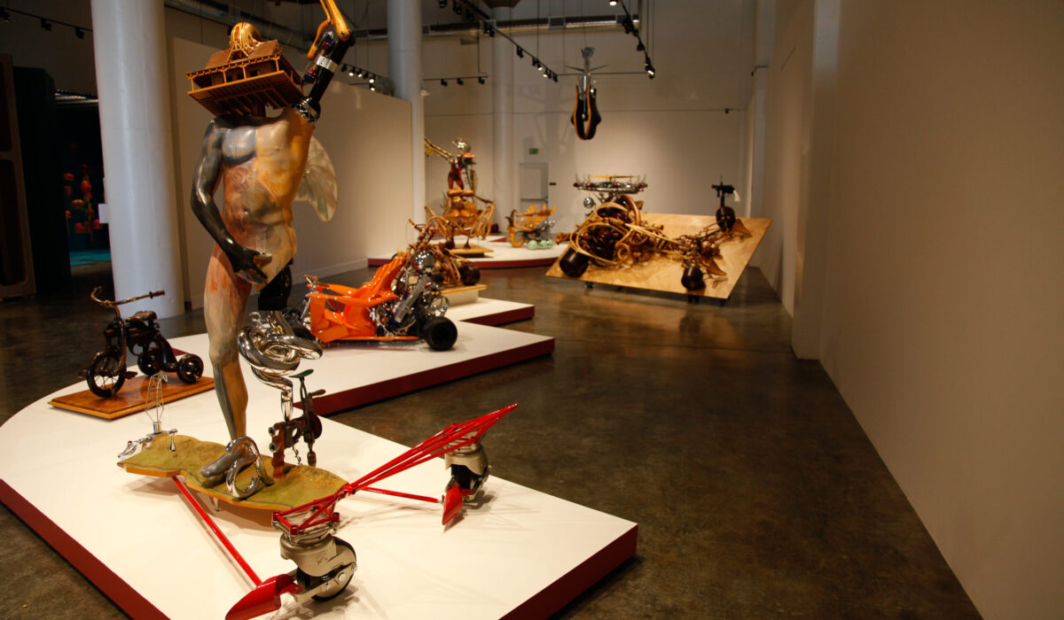Photo of the inside of an exhibition with different types of sculptures