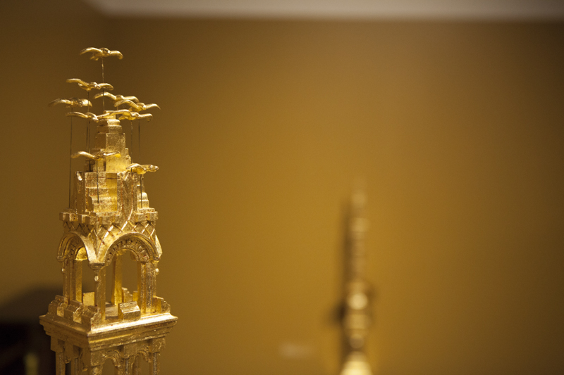 Gold sculpture with gold blurred background