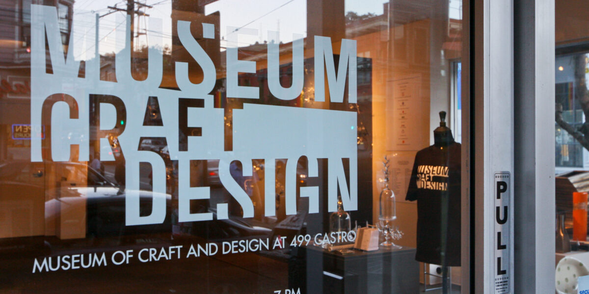 Photo of the museum of craft and designs logo on a glass window