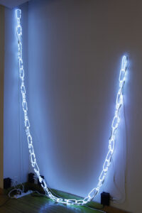 Image of neon chains hung on a wall