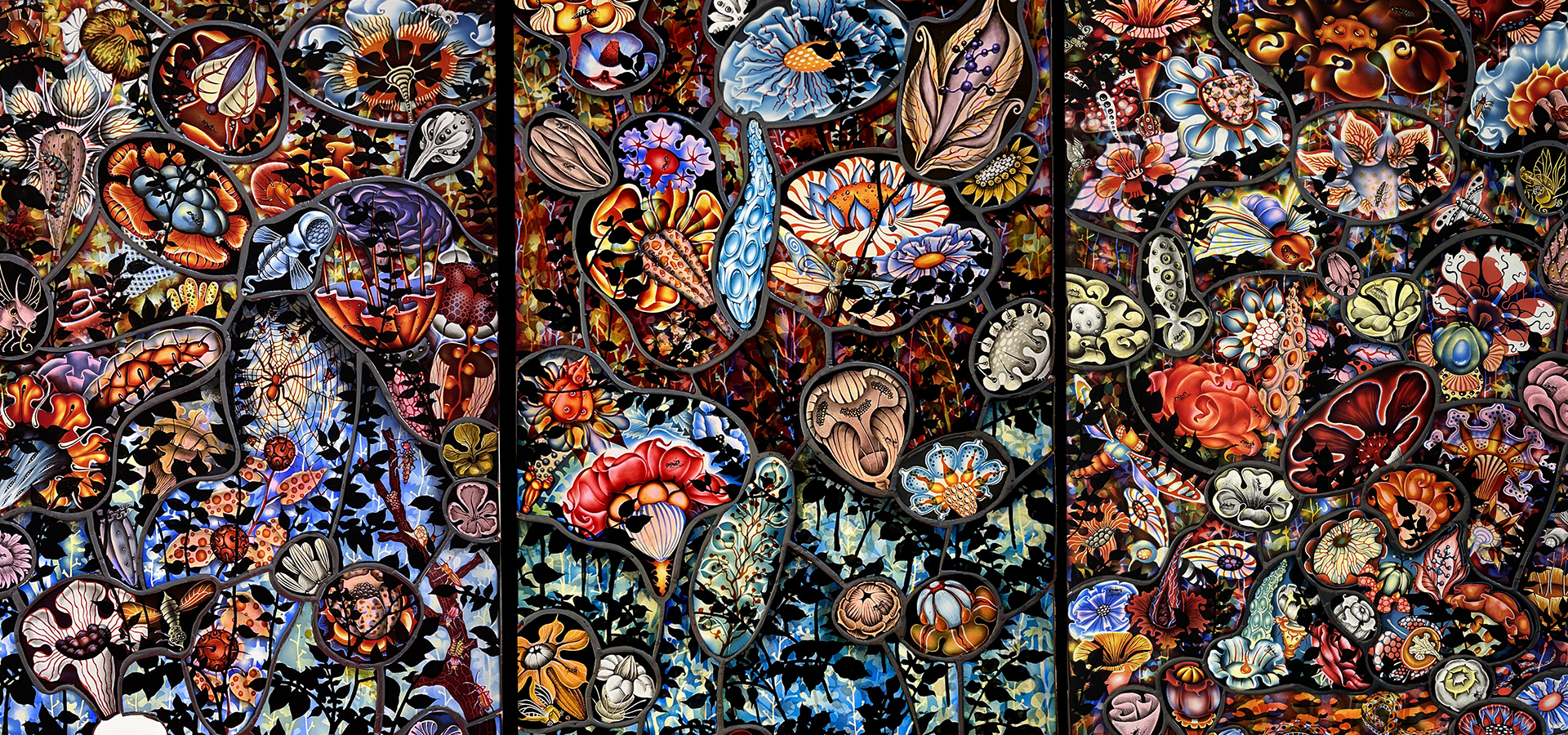 Detailed photo of stained glass panels feature colorful flowers and insects