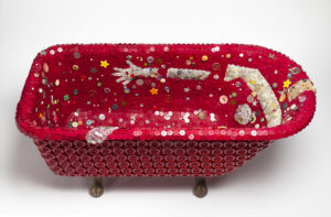 Cast Iron bath tub covered with red buttons