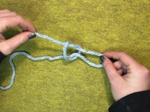 Step 1. Instruction #4 Pull on your short yarn to tighten around your new loop.