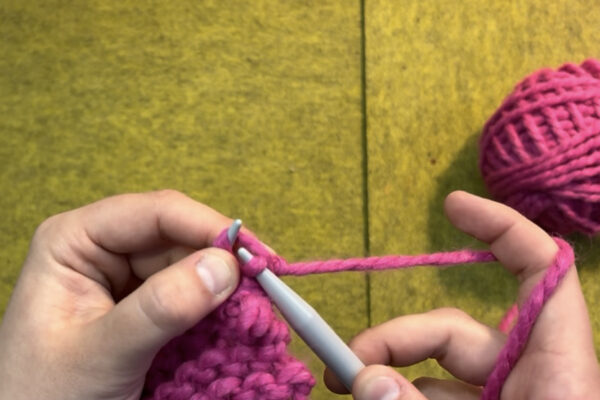 Section 3 - Casting Off: 1. Once you have knit the desired length of rows, it is time to cast off or secure your project off the needles. 2. Knit two stitches onto your right hand needle. 3. Using your left needle, slip the bottom stitch up and over the top stitch so that only one stitch remains on the right hand needle. You have just cast off one stitch.