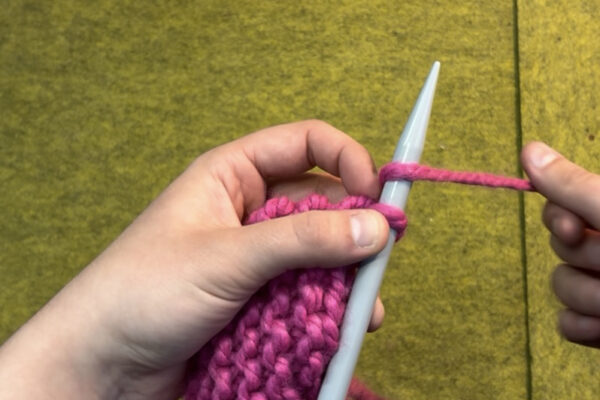 Section 3 - Casting Off: 4. Knit one so there are once again two stitches on your right needle. 5. Slip bottom stitch up and over top stitch so that only one stitch remains on the right hand needle. 6. Repeat step 5 (knit one, slip one) until only the last stitch remains on your right hand needle. 7. When only one stitch total remains, snip your working yarn leaving about a 6 inch tail. 8. Wrap working yarn tail around final stitch and pull bottom stitch up and over with same technique as before. At this point, it will likely be easier to use your fingers rather than your other needle.