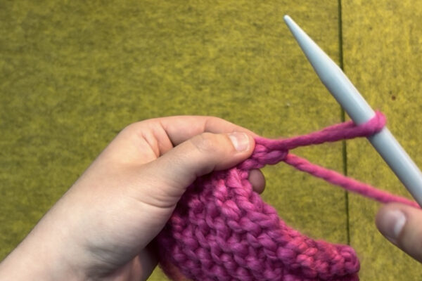 Section 3 - Casting Off: 9. Pull working yarn tail through the final loop you’ve created. 10. Slip project off the needle and pull to tighten. This should create a knot sealing the end of your project!