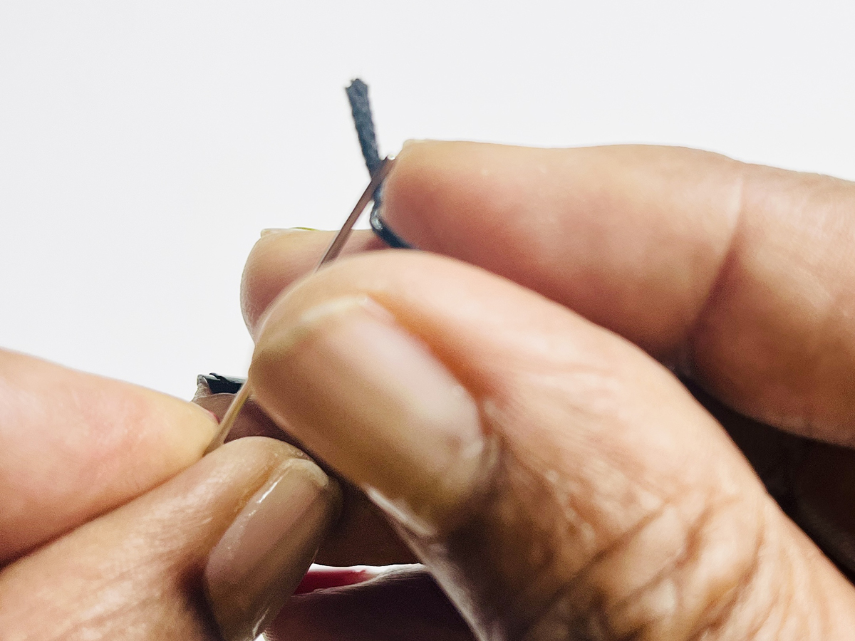 Step 1 - Thread the Needle: 1. Thread needle and position it at embroidery thread midpoint.