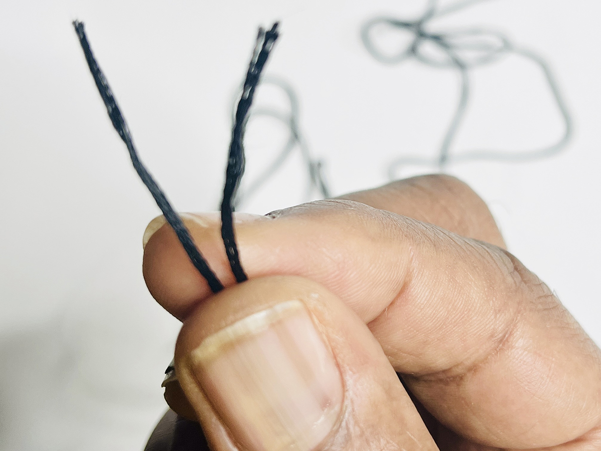 Step 1 - Thread the Needle: 2. Pull the thread halves together so ends meet.