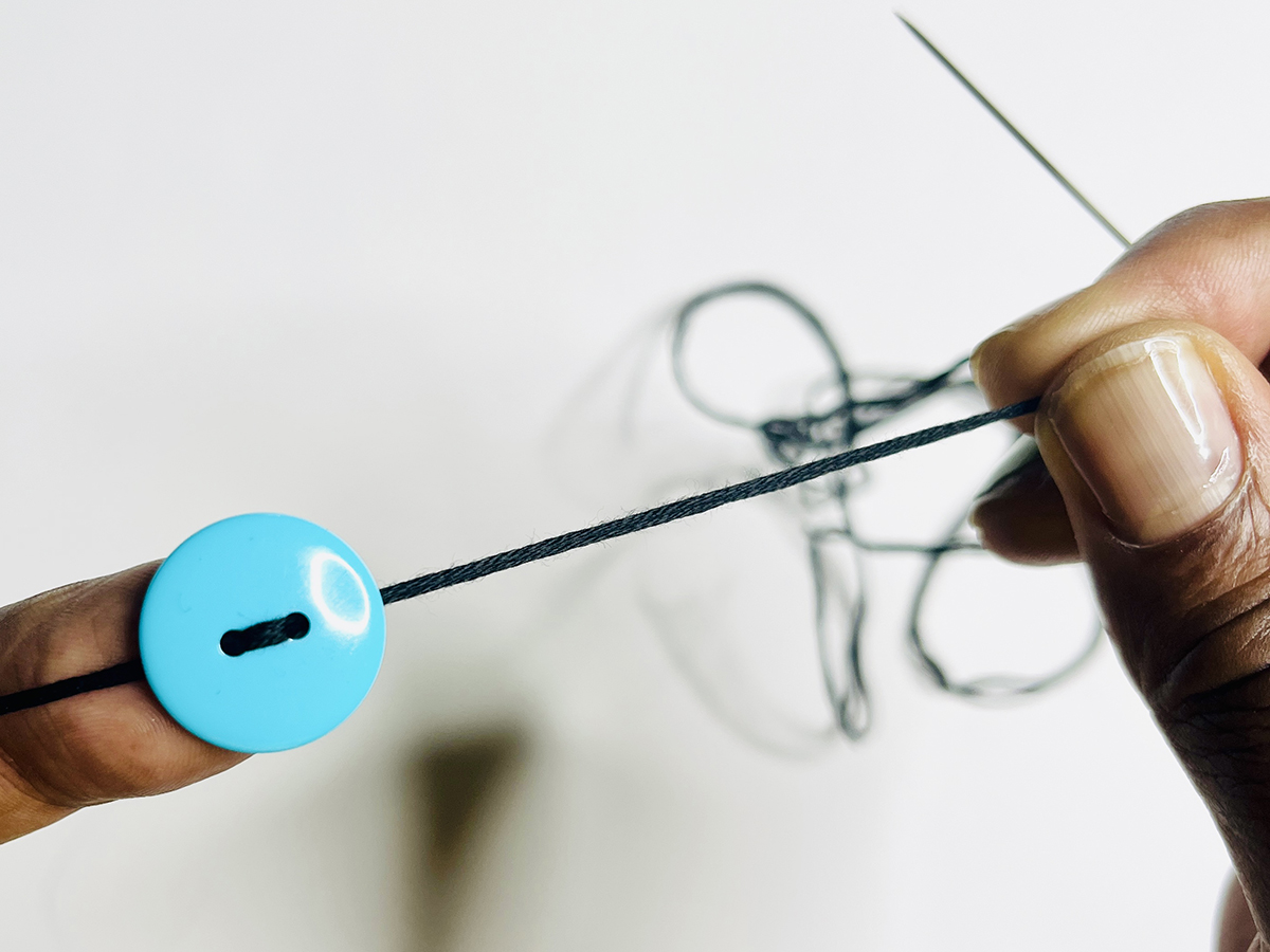 Step 2 - Add the First Button: 3. Stop about four inches before the knot, and leave a four-inch gap between the button and the knot.
