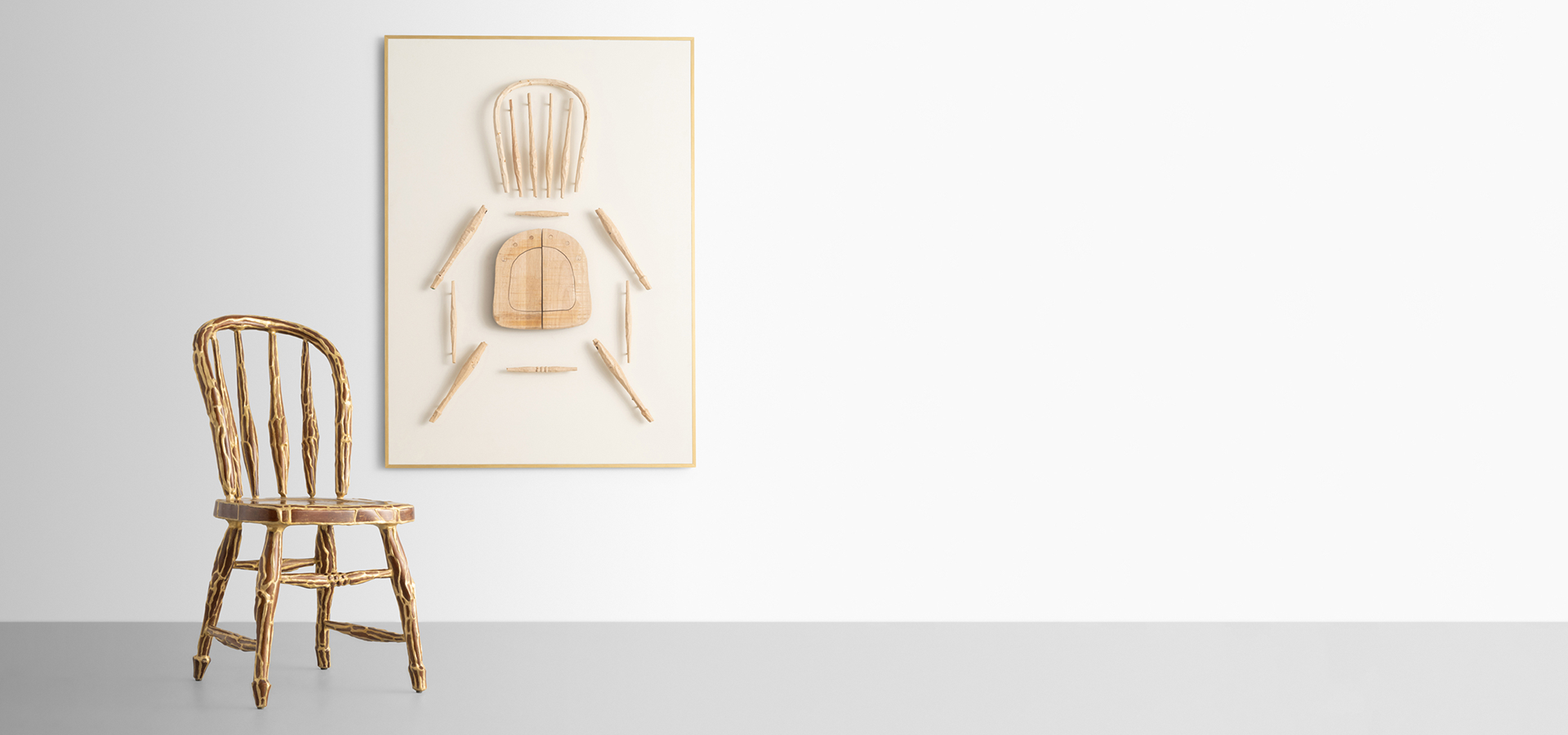 photo of artwork of chair and chair on wall separated.