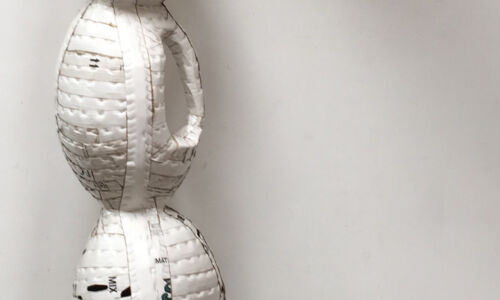 "Personages, Ode to CK" (2012), Ann Weber, Collection of Pamela and David Hornik. 90" x 26" x 28", Found cardboard, staples, polyurethane. Retail Value $7,500